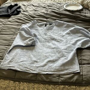 Mossimo light blue, super cute top! Button hole back. Elastic sleeves.